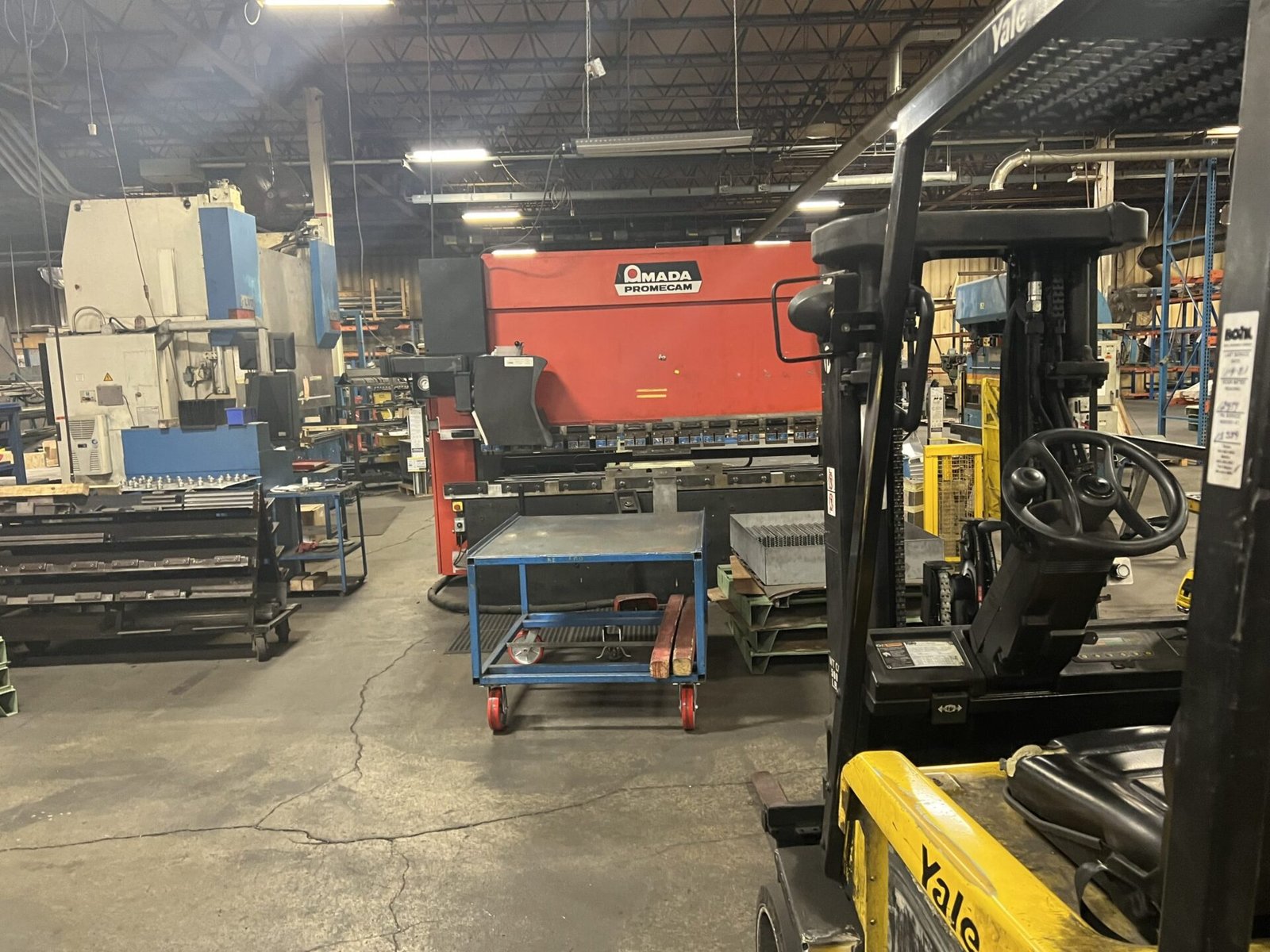 Laser cutting metal processing equipment in a fabrication shop